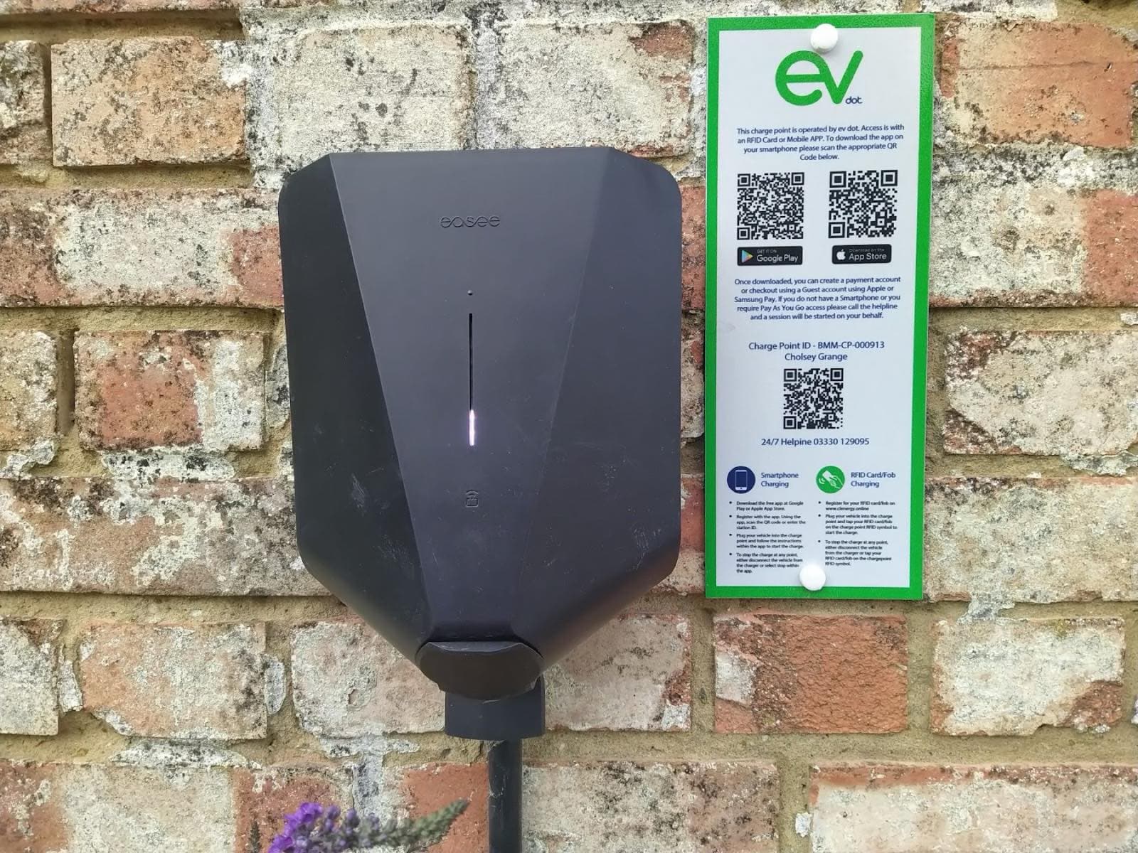 The 22 kW electric vehicle charge point mounted on a brick wall at Cholsey Grange Farm.