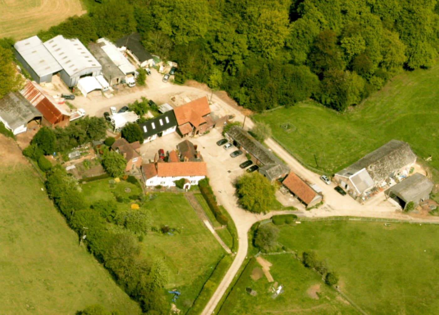 An aerial photograph of Cholsey Grange Farm in June 2009, showing the converted outbuildings, the yard and the surrounding fields.