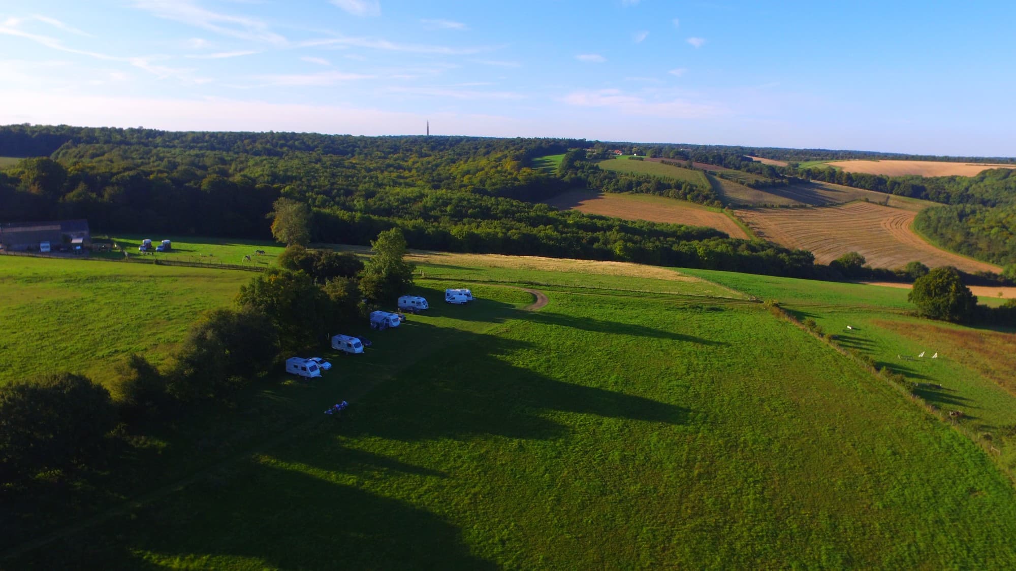 An aerial view of Cholsey Grange, with the farm buildings, the CL field and harvested fields beyond.